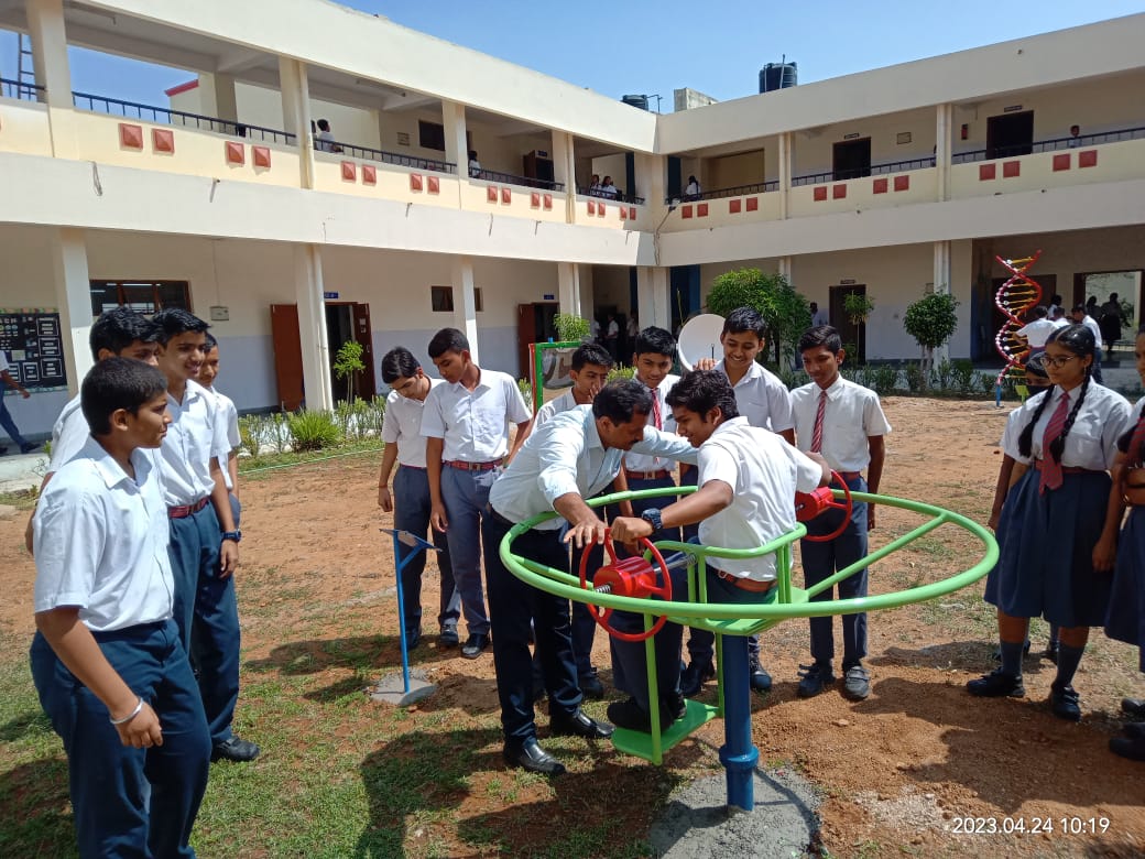 Students observing a display on tour